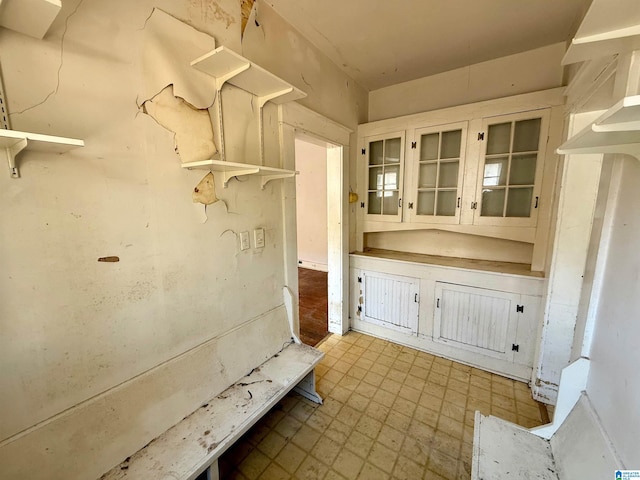 mudroom with tile patterned floors