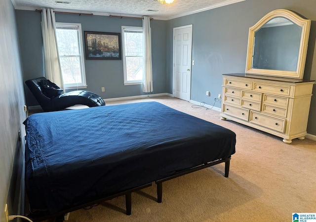 bedroom featuring ornamental molding, baseboards, carpet floors, and a textured ceiling