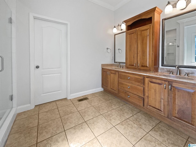 full bath featuring a sink, visible vents, crown molding, and tile patterned floors