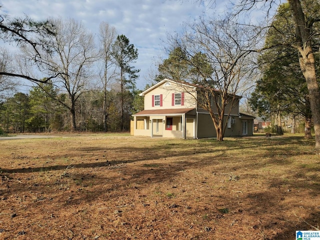 traditional-style home with a front lawn