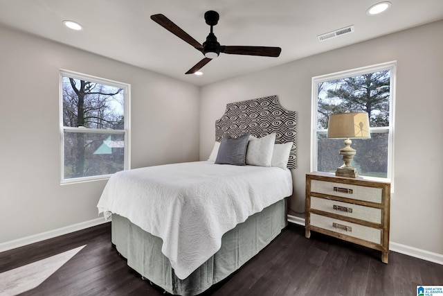 bedroom with a ceiling fan, baseboards, visible vents, recessed lighting, and dark wood-type flooring