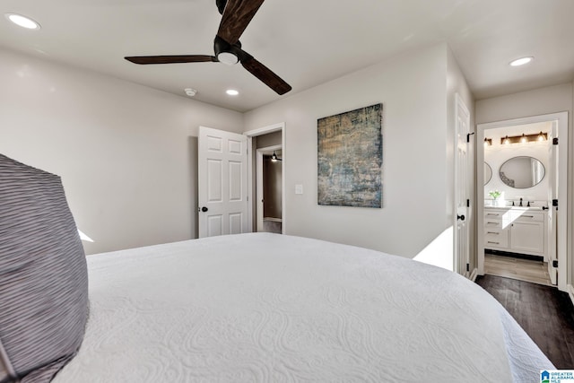 bedroom with recessed lighting, ensuite bath, a ceiling fan, and wood finished floors