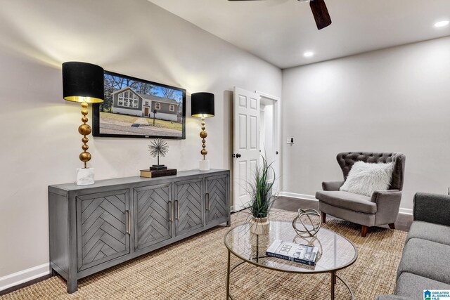 living area with recessed lighting, baseboards, and a ceiling fan