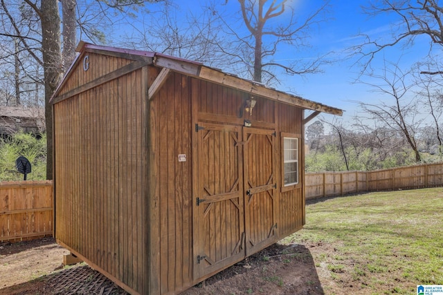 view of shed with a fenced backyard