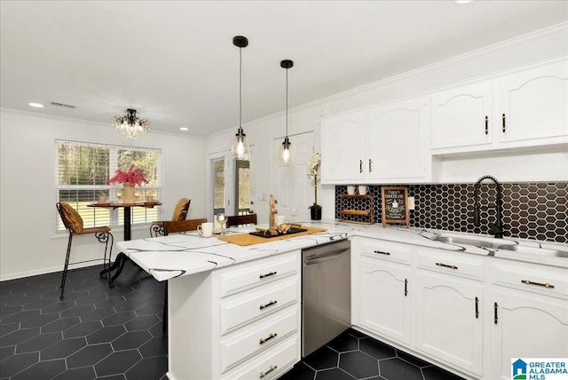 kitchen featuring dark tile patterned floors, ornamental molding, a peninsula, white cabinetry, and stainless steel dishwasher