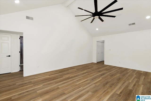 unfurnished room with ceiling fan, wood finished floors, visible vents, and high vaulted ceiling