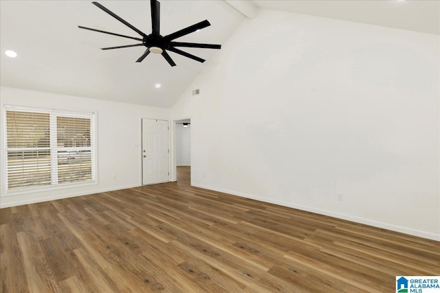 unfurnished room with a ceiling fan, wood finished floors, baseboards, high vaulted ceiling, and beam ceiling