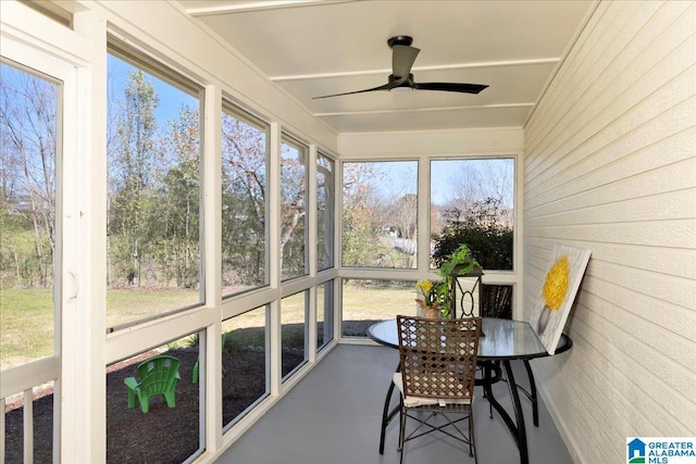 sunroom / solarium featuring ceiling fan