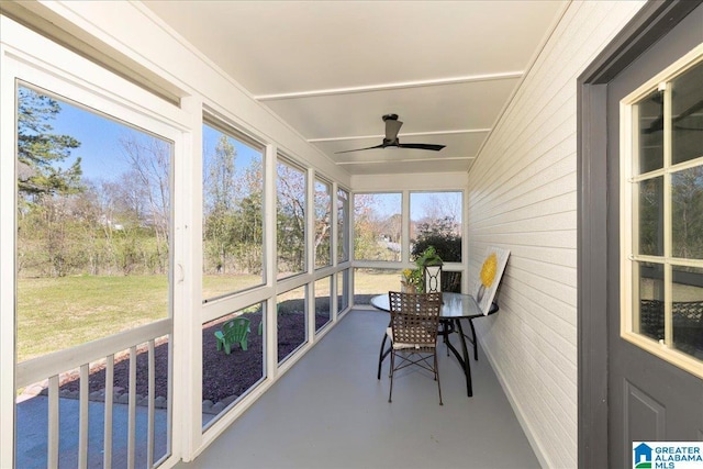 sunroom with a ceiling fan