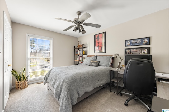 carpeted bedroom featuring a ceiling fan