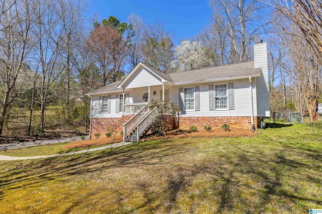 single story home featuring stairs, a porch, a chimney, and a front lawn