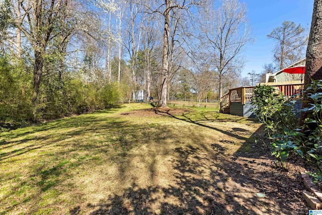 view of yard featuring stairs and a deck