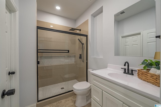 bathroom with visible vents, a shower stall, toilet, recessed lighting, and vanity