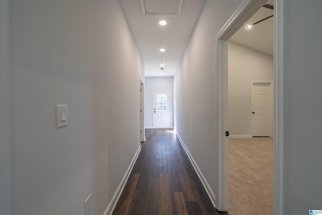 corridor with dark wood finished floors, recessed lighting, attic access, and baseboards