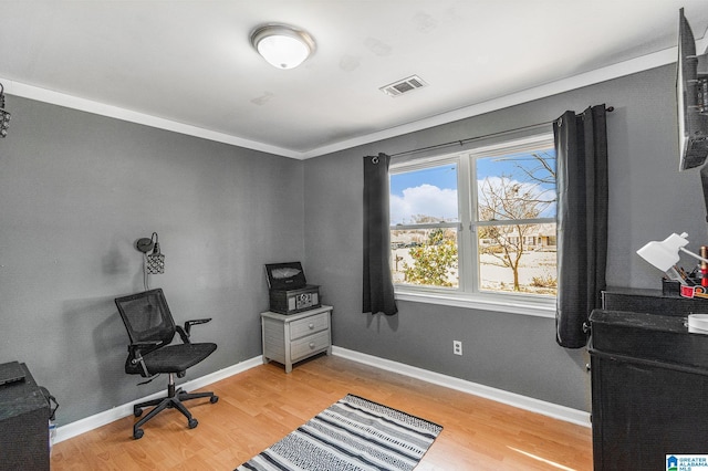 office featuring light wood-style floors, visible vents, and baseboards