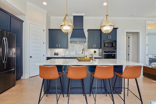 kitchen with backsplash, light countertops, a kitchen bar, appliances with stainless steel finishes, and custom exhaust hood