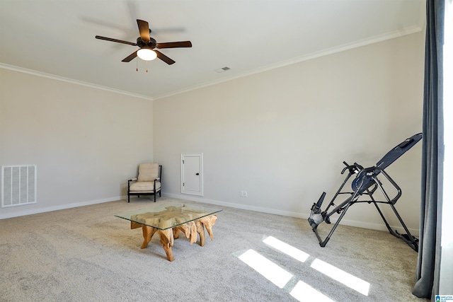 unfurnished room featuring visible vents, carpet, crown molding, and a ceiling fan