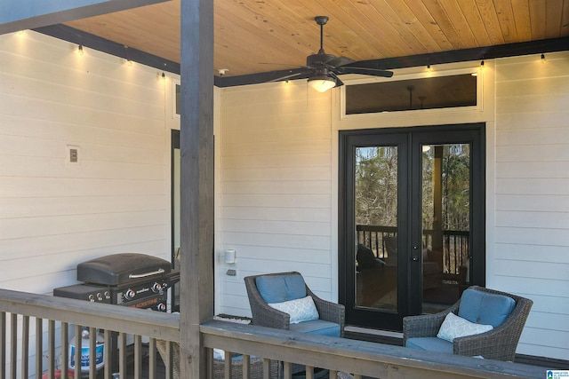 exterior space with a grill, french doors, and ceiling fan