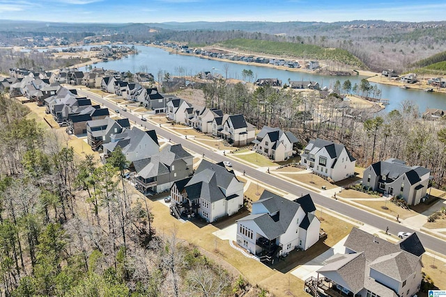 birds eye view of property with a residential view and a water view