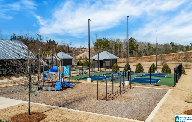 communal playground featuring fence