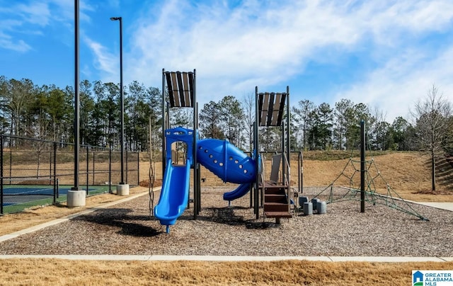 communal playground featuring fence