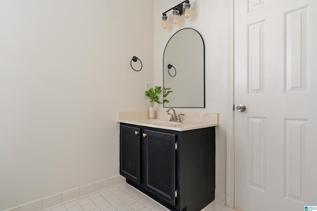 bathroom featuring vanity, tile patterned floors, and baseboards