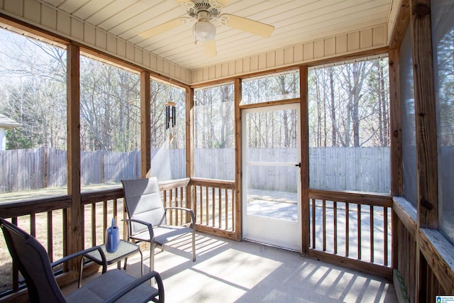 sunroom with a ceiling fan