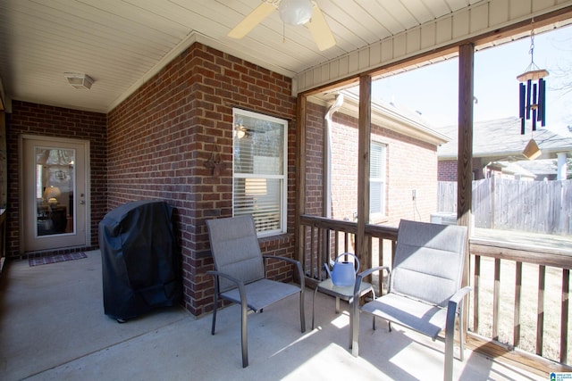 sunroom / solarium with ceiling fan