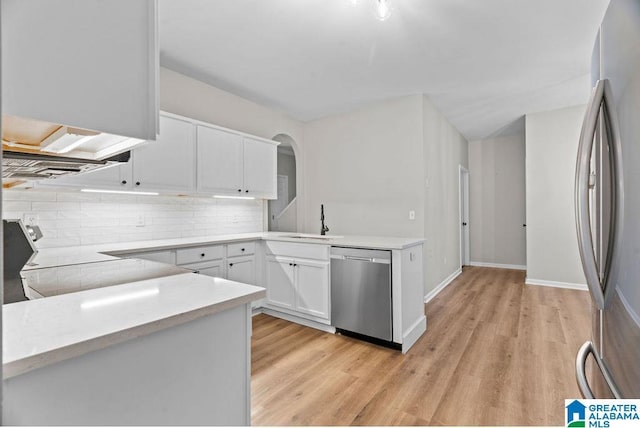 kitchen featuring a sink, light countertops, white cabinetry, and stainless steel appliances