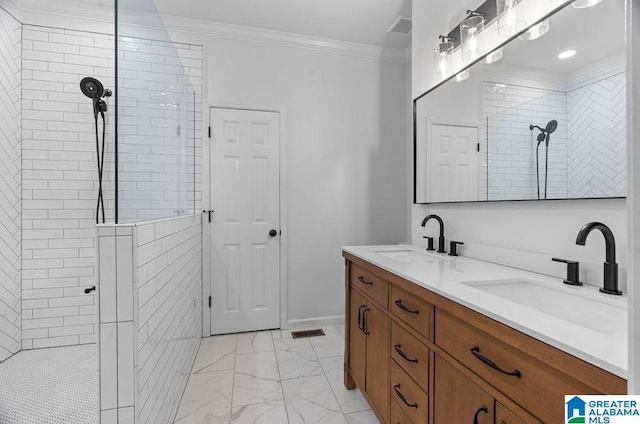 full bath featuring a sink, marble finish floor, ornamental molding, and a walk in shower