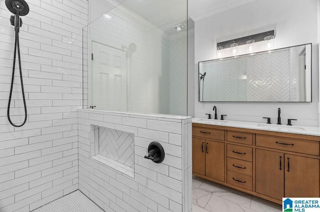 full bath with ornamental molding, marble finish floor, walk in shower, and a sink