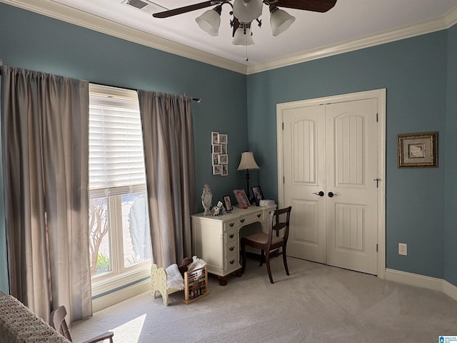 office area featuring baseboards, carpet floors, ornamental molding, and a ceiling fan