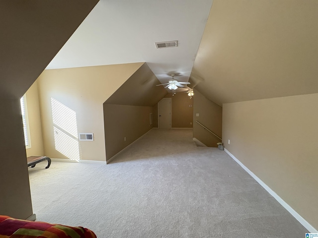 bonus room featuring visible vents, carpet floors, a ceiling fan, and vaulted ceiling