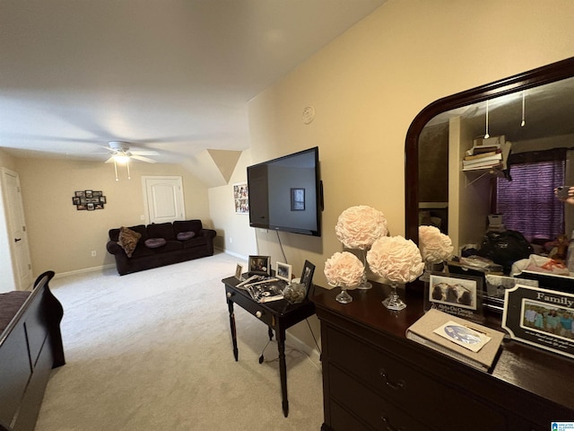 living room with arched walkways, light colored carpet, baseboards, and ceiling fan