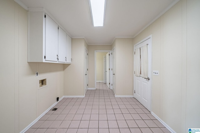 laundry area featuring a decorative wall, cabinet space, electric dryer hookup, and washer hookup