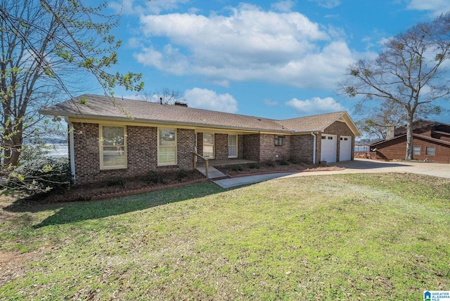 single story home featuring brick siding, an attached garage, concrete driveway, and a front lawn