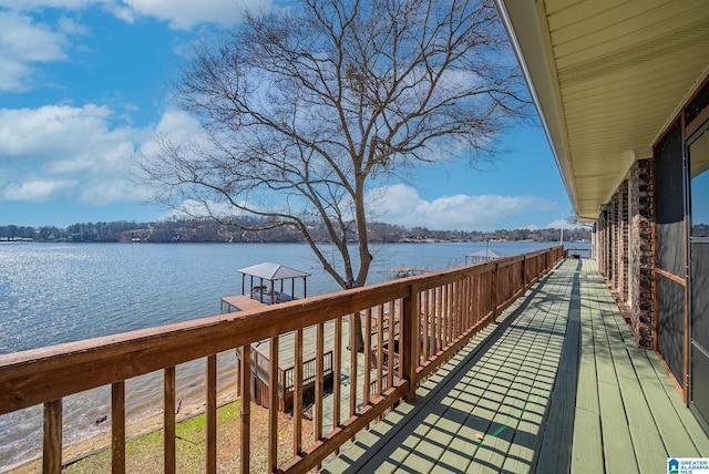 deck featuring a water view and a dock