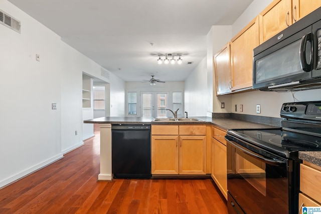 401 20th St S Unit 309, Birmingham, AL 35233 - kitchen featuring visible vents, black appliances, a ceiling fan, a sink, and a peninsula