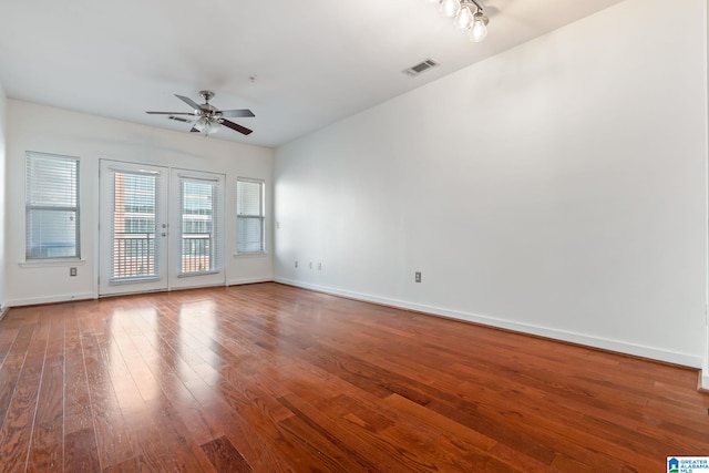 401 20th St S Unit 309, Birmingham, AL 35233 - unfurnished room with hardwood / wood-style floors, baseboards, visible vents, ceiling fan, and french doors