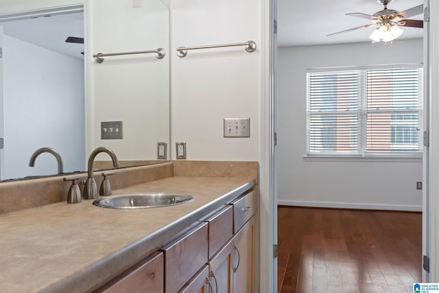 401 20th St S Unit 309, Birmingham, AL 35233 - bathroom featuring hardwood / wood-style floors, vanity, a ceiling fan, and baseboards