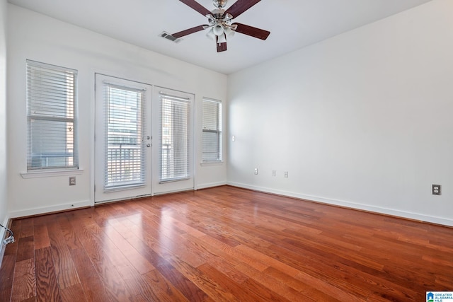 401 20th St S Unit 309, Birmingham, AL 35233 - unfurnished room featuring a ceiling fan, wood finished floors, visible vents, baseboards, and french doors
