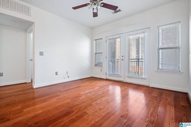 401 20th St S Unit 309, Birmingham, AL 35233 - empty room featuring light wood-type flooring, visible vents, a ceiling fan, and french doors