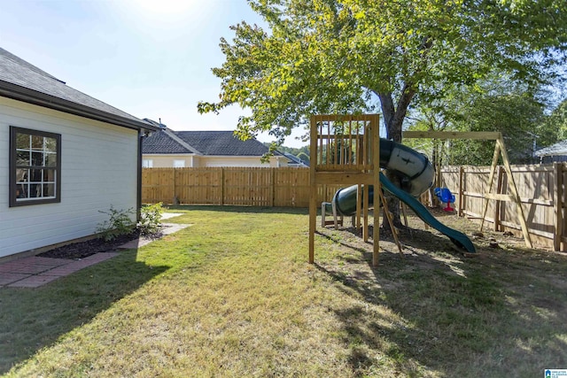 view of yard featuring a playground and a fenced backyard