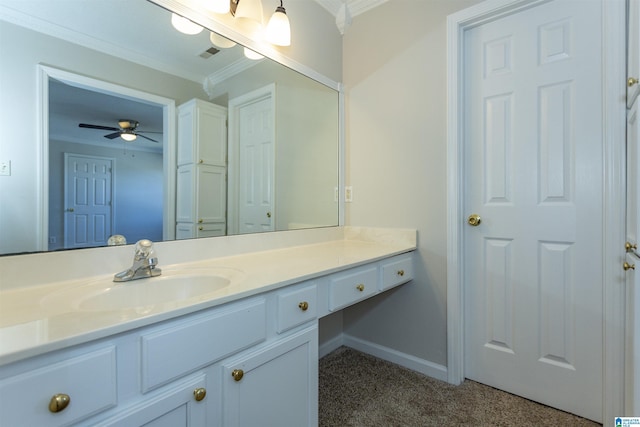 bathroom featuring vanity, baseboards, visible vents, ceiling fan, and crown molding