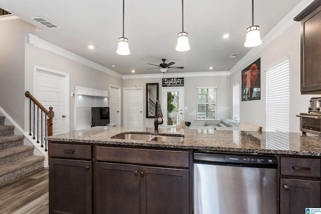 kitchen with a sink, dark brown cabinetry, dishwasher, and open floor plan