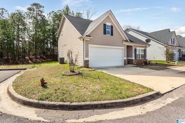 view of front of home featuring cooling unit, a front lawn, concrete driveway, a garage, and brick siding