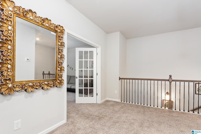 interior space with baseboards and carpet floors