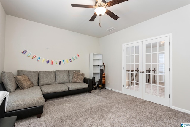 living area with visible vents, baseboards, carpet, french doors, and a ceiling fan