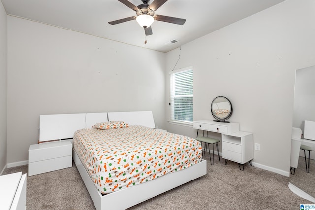 bedroom with light carpet, visible vents, and baseboards