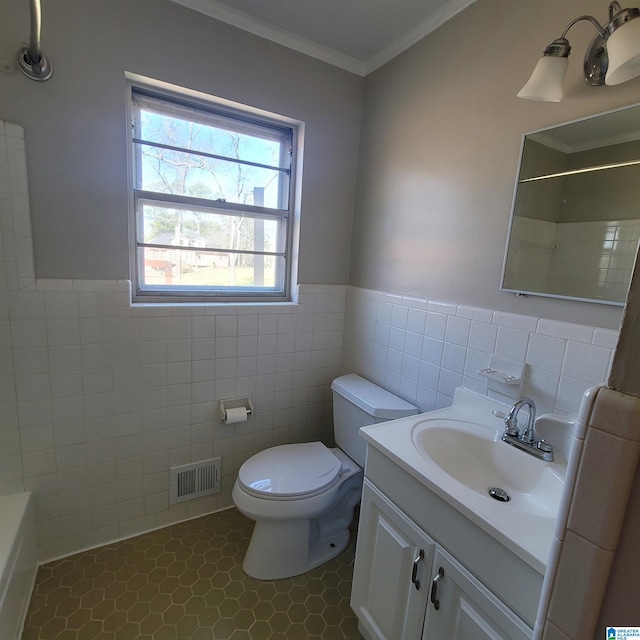 full bath with visible vents, toilet, ornamental molding, vanity, and a shower